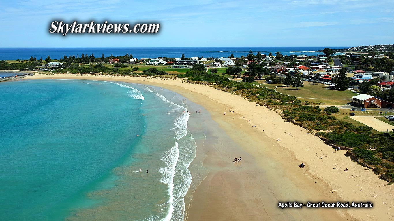 people at sandy beach, turquoise water