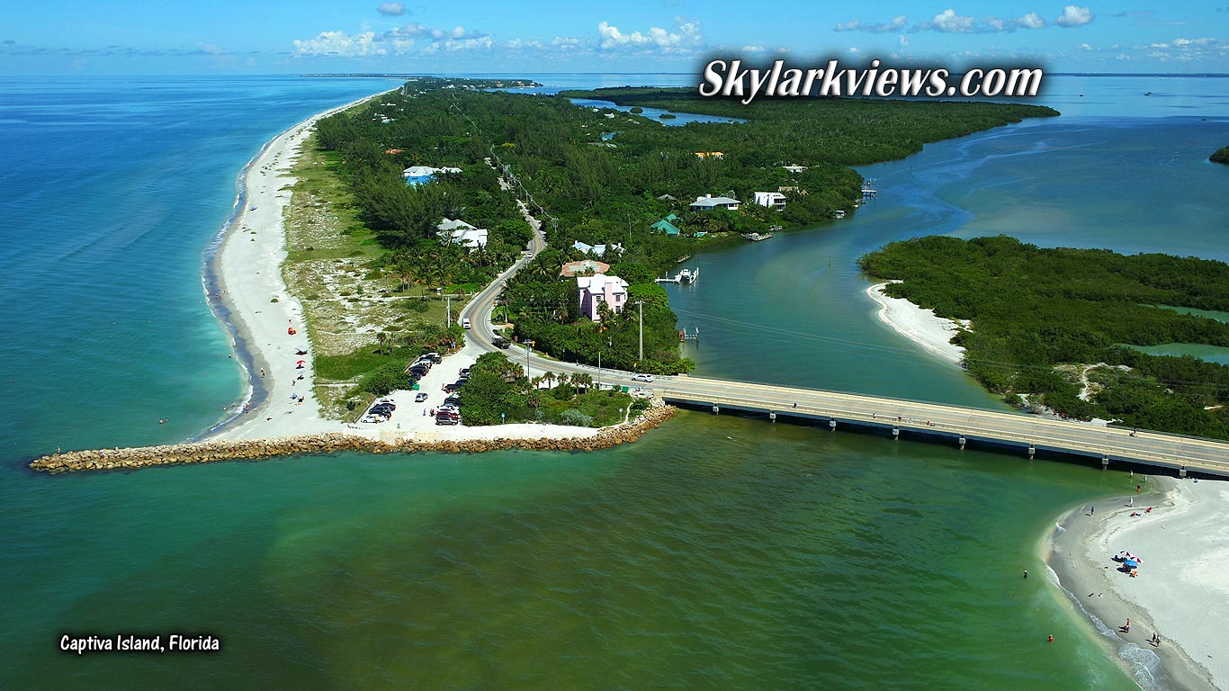 bridge connecting two islands; long sandy beach