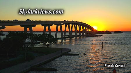 sunset behind the sanibel bridge