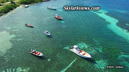 small boats, crystal clear water